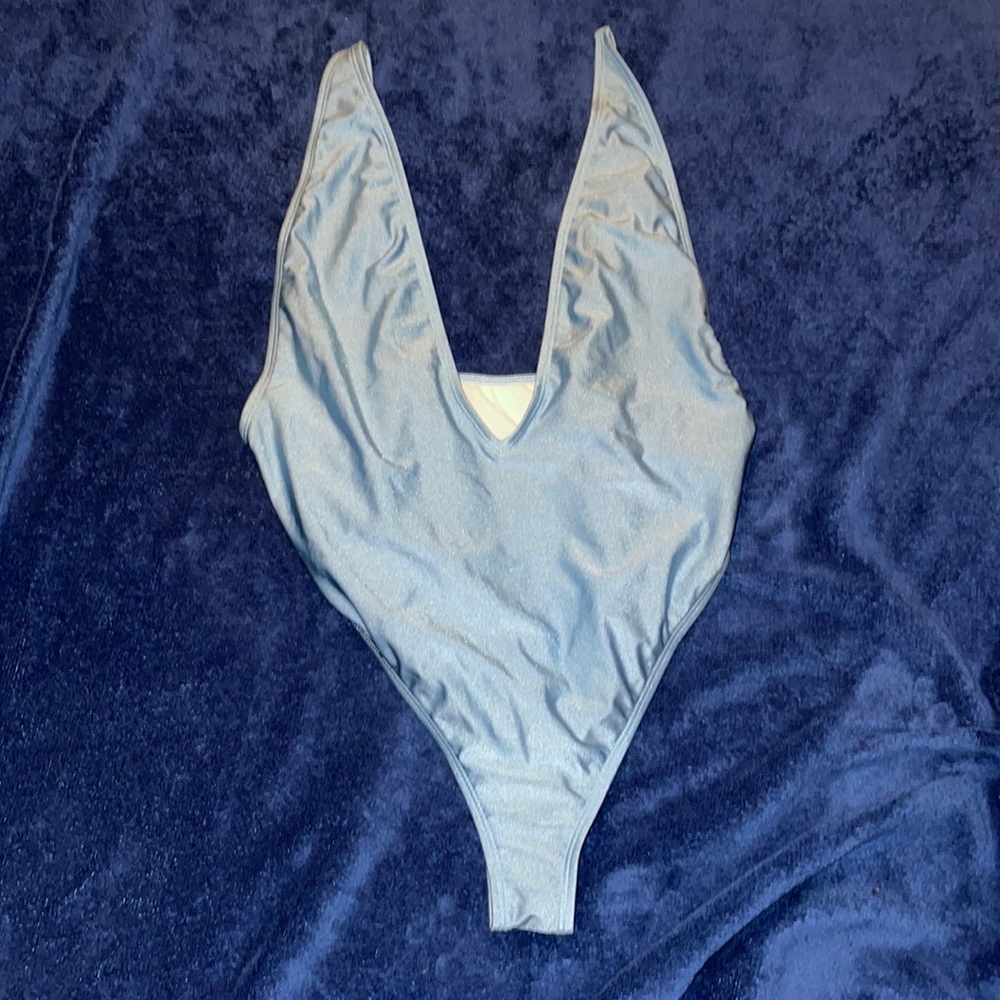 Metallic Blue V neck cut one piece swimsuit from fashion nova size XL.